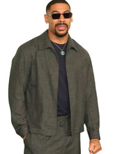 Aaron Pierre grey jacket with zipper closure and buttoned cuffs
