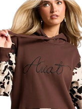 Brown cow print fleece hoodie with open-hem cuffs