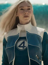A blonde woman wearing a blue and white high-collar jacket with a large white '4' logo on the chest, set against a blurred teal and white background.