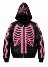 A black leather zip-up hoodie with a pink rib cage graphic on the front, pink flame-like graphics on the sleeves, a pink star logo on the hood, and a circular patch on the right sleeve.