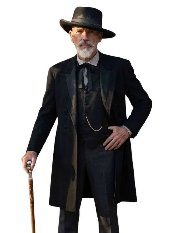 A man dressed in a vintage Victorian-era black suit with a long overcoat, vest, tie, black hat, white beard, and holding a cane, isolated on a white background.