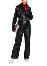 Front view of women’s textured black leather jumpsuit