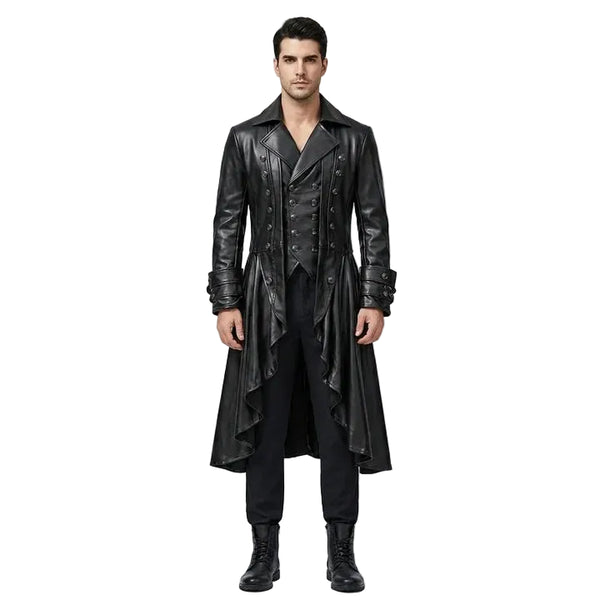 A man modeling a long black faux-leather gothic-style coat over a black vest, black shirt, black trousers, and black boots, standing against a light gray studio background.