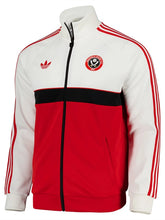 A red and white Adidas track jacket with a black center stripe and zipper, featuring the Vancouver Canucks logo on the chest.