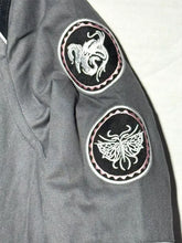 Red and grey KDA jacket with snap-tab collar