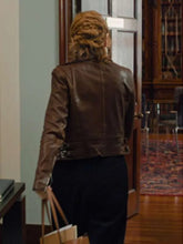 Brown biker jacket with three front pockets and full-length sleeves