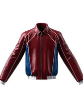 A red and blue leather jacket with white piping details, featuring a zip-up front, pointed collar, and ribbed cuffs and hem.