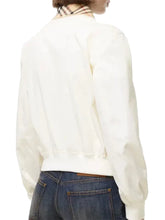 Cropped cream jacket featuring rib-knitted cuffs