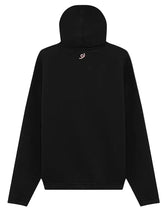 A black pullover hoodie shown from the back, featuring a small pink swirl logo centered below the neckline, set against a solid light gray background.