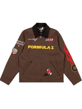 A brown zip-up jacket featuring 'FORMULA 1' printed in yellow across the chest, a black collar, and various racing-themed graphics including a red fire emblem on the right sleeve and a small red race car illustration near the lower left front.
