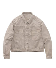 A light beige utility jacket with a button-up front, two buttoned chest flap pockets, and a relaxed fit, shown flat against a plain white background.