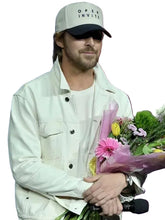 Man holding flowers with a colorful background