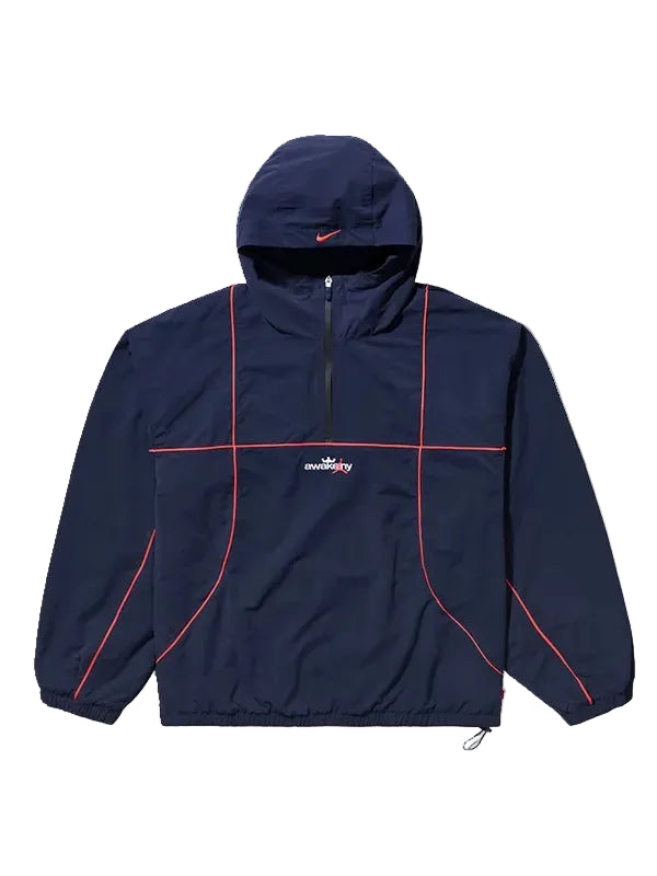 A navy blue hooded windbreaker jacket with red piping details and a white 'streetfly' logo on the chest, displayed against a solid light gray background.