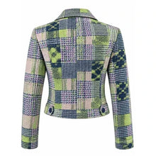 A cropped long-sleeve blazer with a textured tweed plaid pattern in green, navy, purple, and beige, shown from the back on a white background.