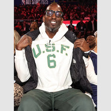 A man wearing a white U.S.
