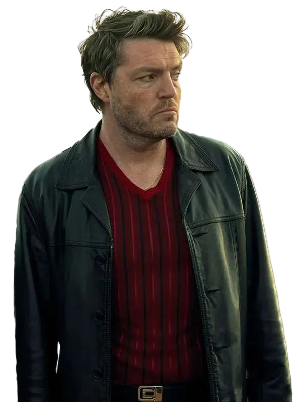 A man wearing a black leather jacket over a red and black vertically striped V-neck sweater, shown from the chest up against a plain light gray background.