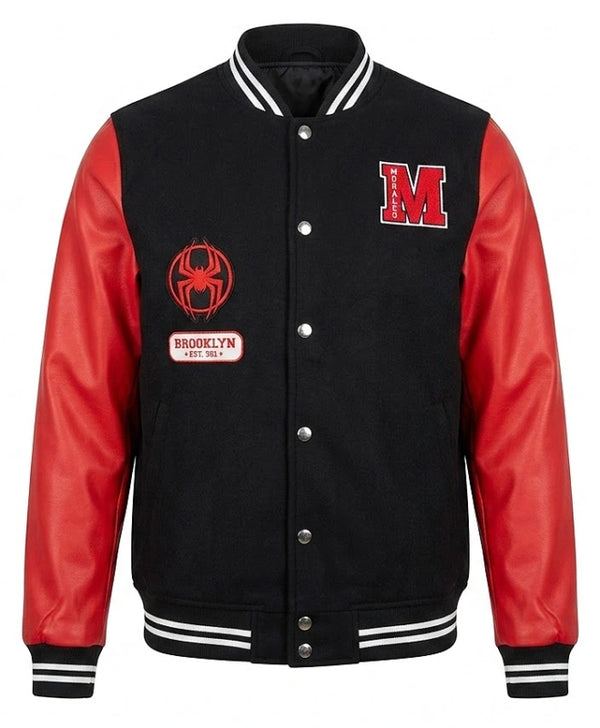 A black and red varsity jacket with a black wool body, red leather sleeves, and white striped ribbed collar, cuffs, and hem. It features a red block 'M' on the left chest, a red spider emblem with 'Brooklyn' on the right chest, and silver snap buttons.