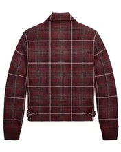 A cropped plaid jacket with a collar, shown from the back. The fabric features a dark red and brown tartan pattern with thin white grid lines, and has toggle details at the bottom hem.