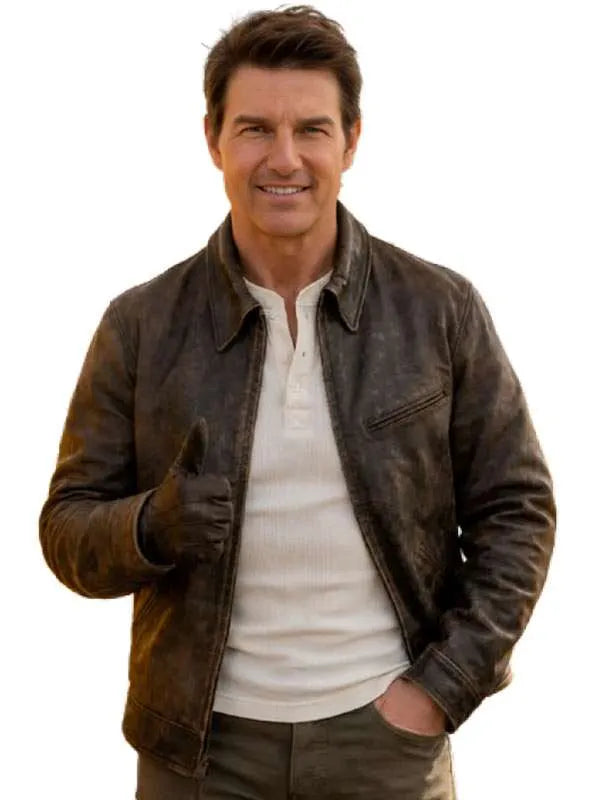 A man wearing a distressed brown leather jacket over a white henley shirt, standing against a plain white background and giving a thumbs-up.