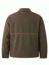 The back view of a brown utility jacket with a horizontal seam across the upper back and a subtle light-colored stitched detail, shown on a plain white background.