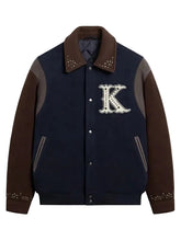 Navy and brown studded jacket with buttoned cuffs