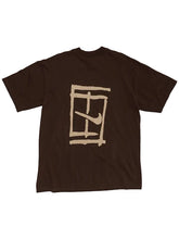 A dark brown short-sleeve t-shirt with a beige graphic print on the front, featuring a stylized window frame and a Nike swoosh, displayed against a light gray background.