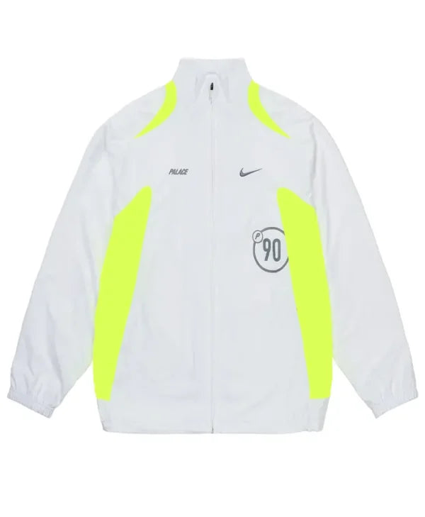 A white zip-up track jacket featuring neon yellow-green side panels and shoulder accents, with a black Palace logo on the right chest, a black Nike swoosh on the left chest, and a circular 'P90' graphic on the front.