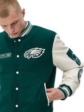 Green wool varsity jacket with two front pockets and two inside pockets