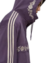 Purple oversized hooded track jacket with half-zip closure