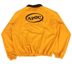 A yellow windbreaker jacket shown from the back, featuring a black collar, elastic cuffs and hem, and a large black oval 'APOC' logo printed on the upper back.