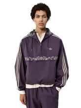Purple polyester track jacket with elastic cuffs