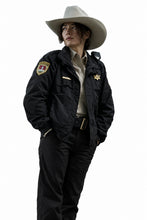 Kelly Macdonald black jacket with zipper closure and rib-knitted cuffs