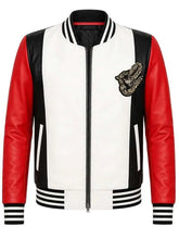 A varsity-style leather jacket with a white body, red sleeves, and black striped ribbed collar, cuffs, and hem. It features a black zipper, a black embroidered lion patch on the left chest, and white vertical zipper pockets.