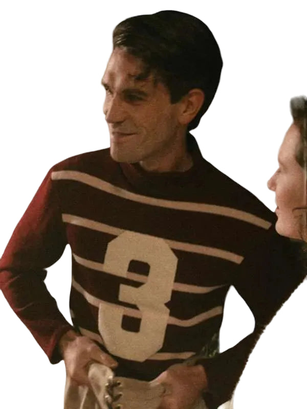 A man wearing a dark brown and beige striped sweater with a large number 3 on the front, shown in a close-up shot against a white background.