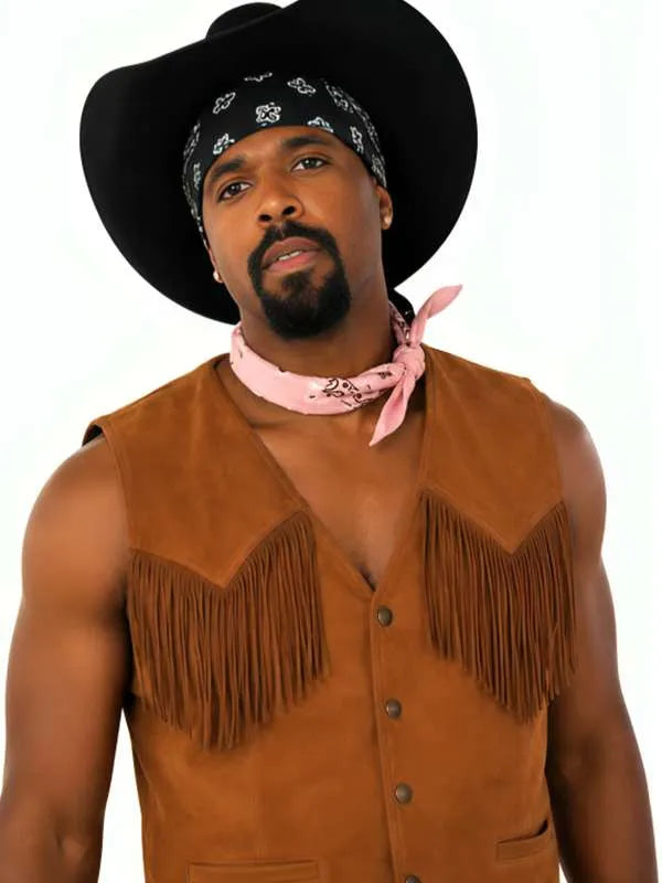 A man wearing a brown suede-like fringe vest, black cowboy hat, black bandana, and pink neckerchief, photographed against a plain white background.