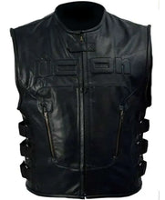 Black leather motorcycle vest with embossed 'ICON' lettering on the chest, front zipper, zippered pockets, and side lacing details, shown against a plain white background.