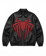 Black faux leather bomber jacket featuring a large red spider emblem on the front, displayed flat against a white background.