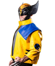 A man wearing a Wolverine costume jacket with a yellow body, blue shoulder cape, and black mask, posed against a solid black background.