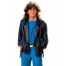 A man modeling a black studded leather jacket over a bright blue t-shirt and matching blue pants, set against a plain white background.
