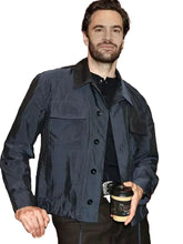 Navy blue satin jacket with buttoned front closure