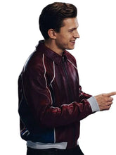 A man wearing a dark red leather bomber jacket with white piping and white ribbed trim, shown in profile against a plain white background.
