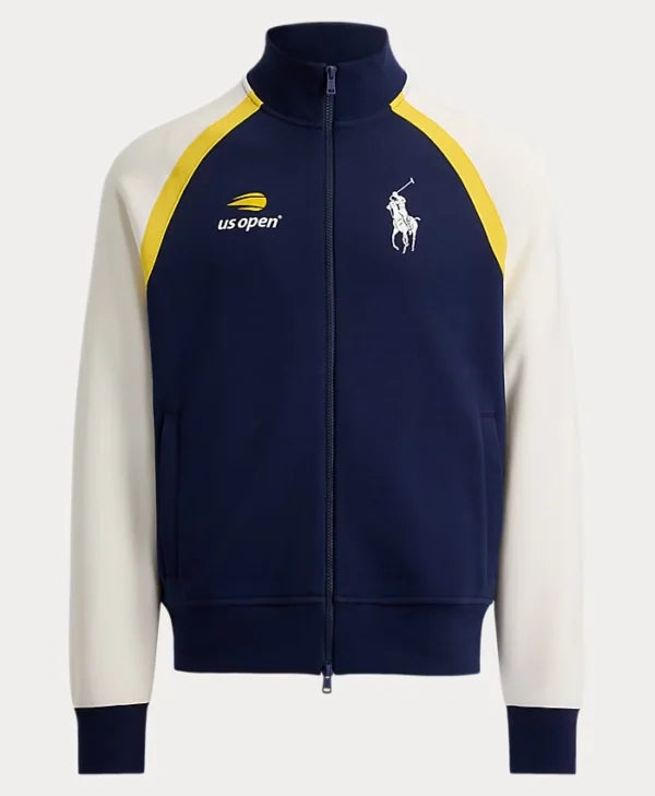 A navy blue and off-white zip-up track jacket featuring yellow shoulder panels, a navy stand collar, ribbed cuffs and hem, the Polo Ralph Lauren logo on the left chest, and the usopen logo on the right chest.