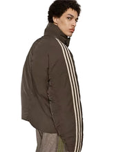 Brown oversized puffer jacket with button and zipper closure