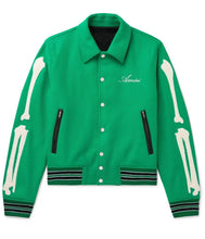 Green jacket with bone designs and 'Amiri' branding on a white background