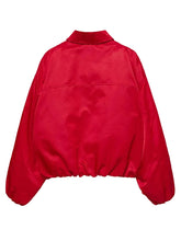 A bright red satin jacket with a high collar and voluminous balloon sleeves, shown from the back against a light gray background.