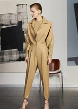 Front view of women’s light brown leather jumpsuit